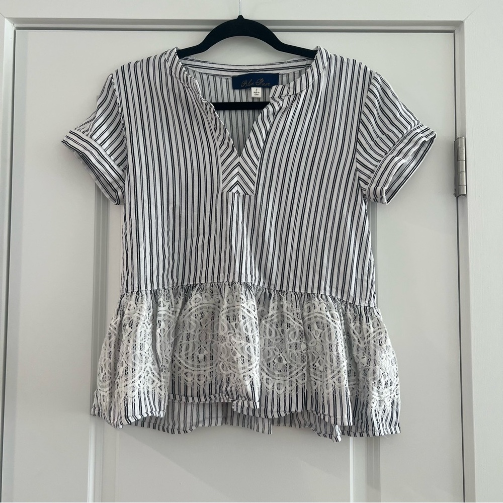 White top with black stripes
